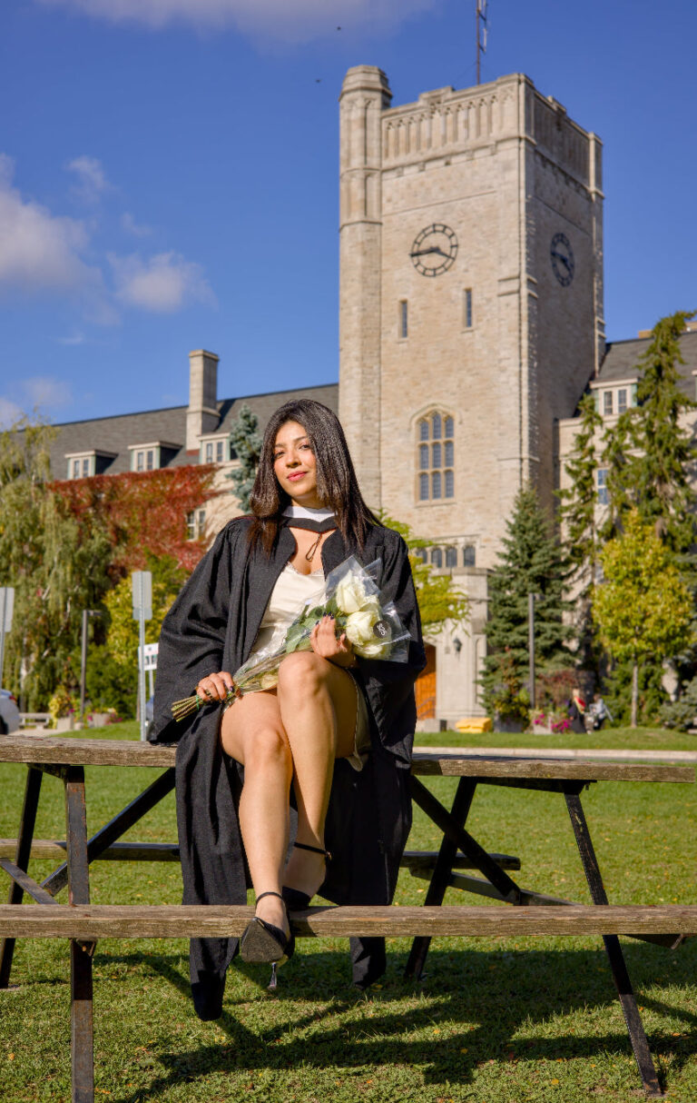 Graduates running toward the camera on Johnston Green