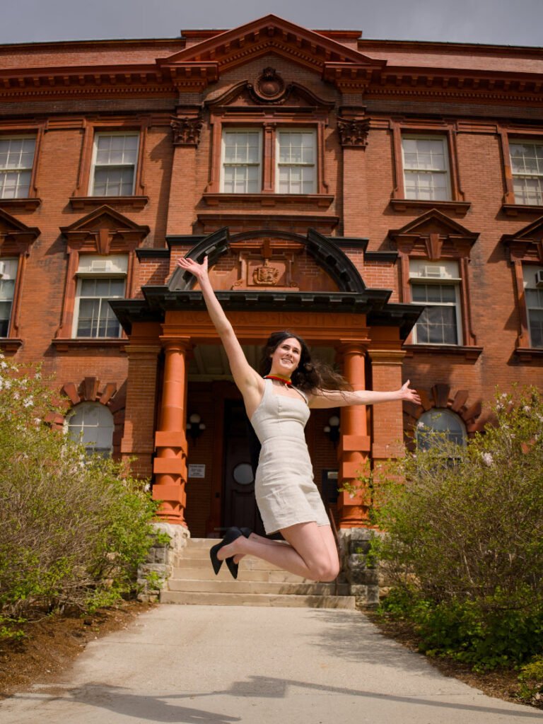 Graduates photographed by the historic architecture on the north side of the University of Guelph campus