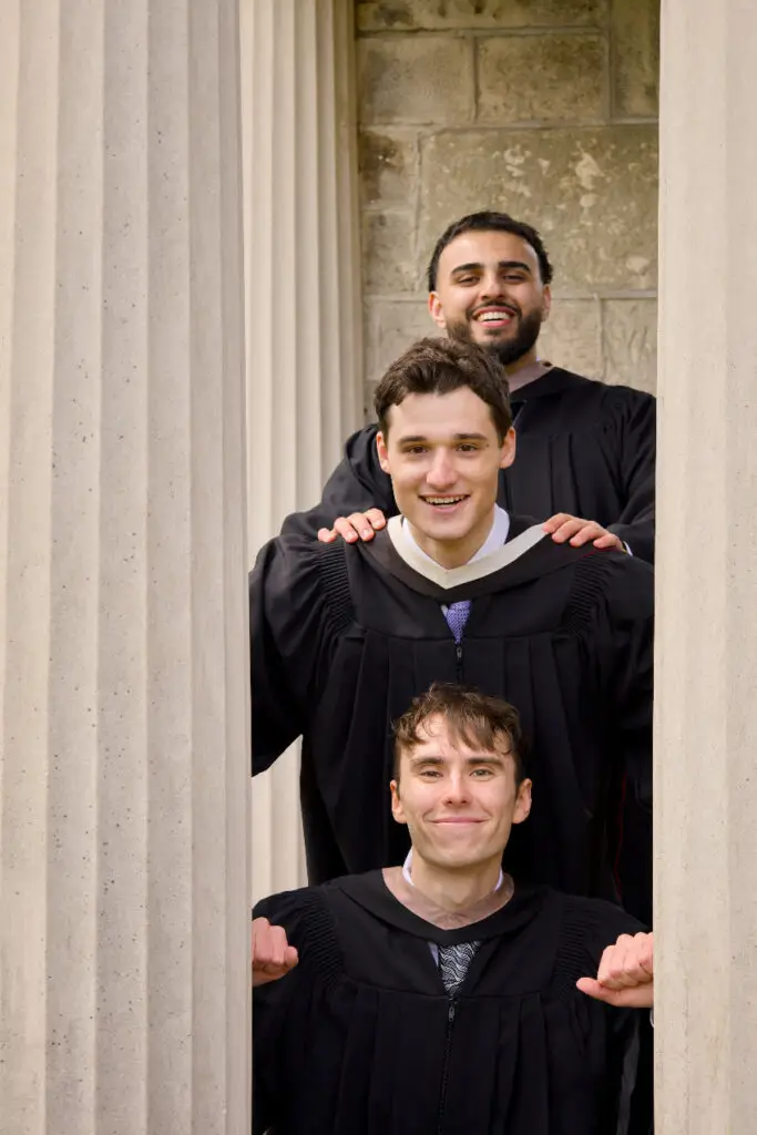 A group of graduates with coordinated outfits photographed together